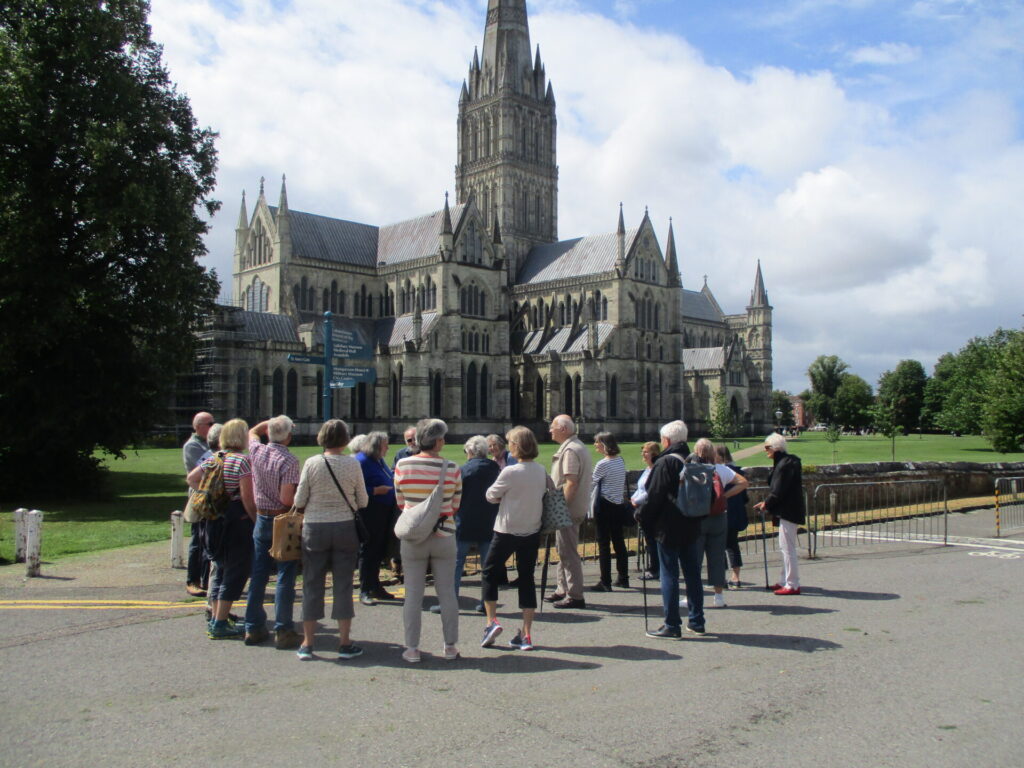 A large group of people looking towards Salisbury Cathedral