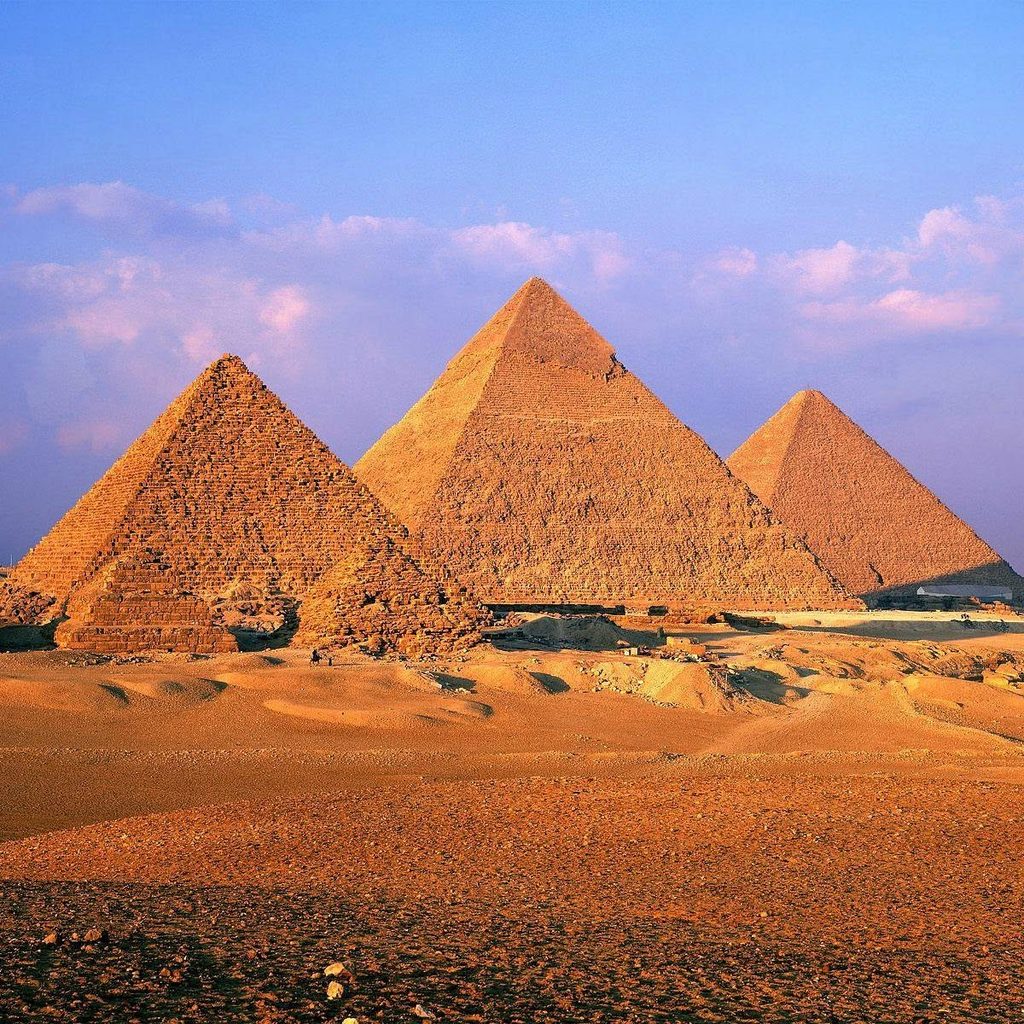 A picture of the pyramids against a blue sky